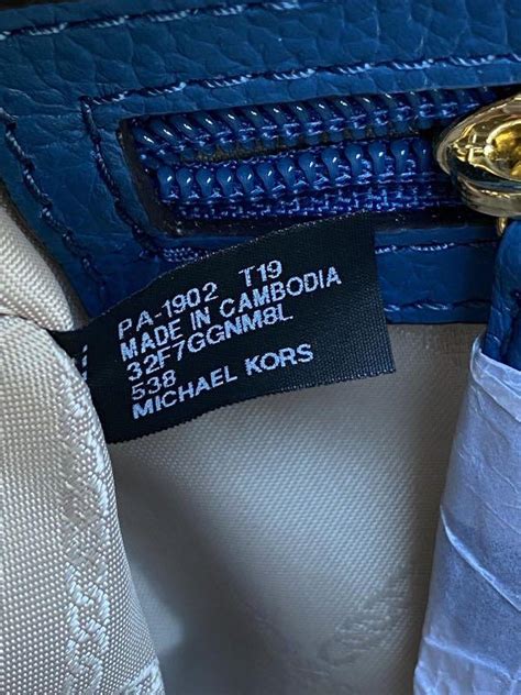 kors michael kors label - Michael Kors made in cambodia.